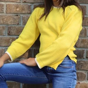 Girl’s yellow sweater